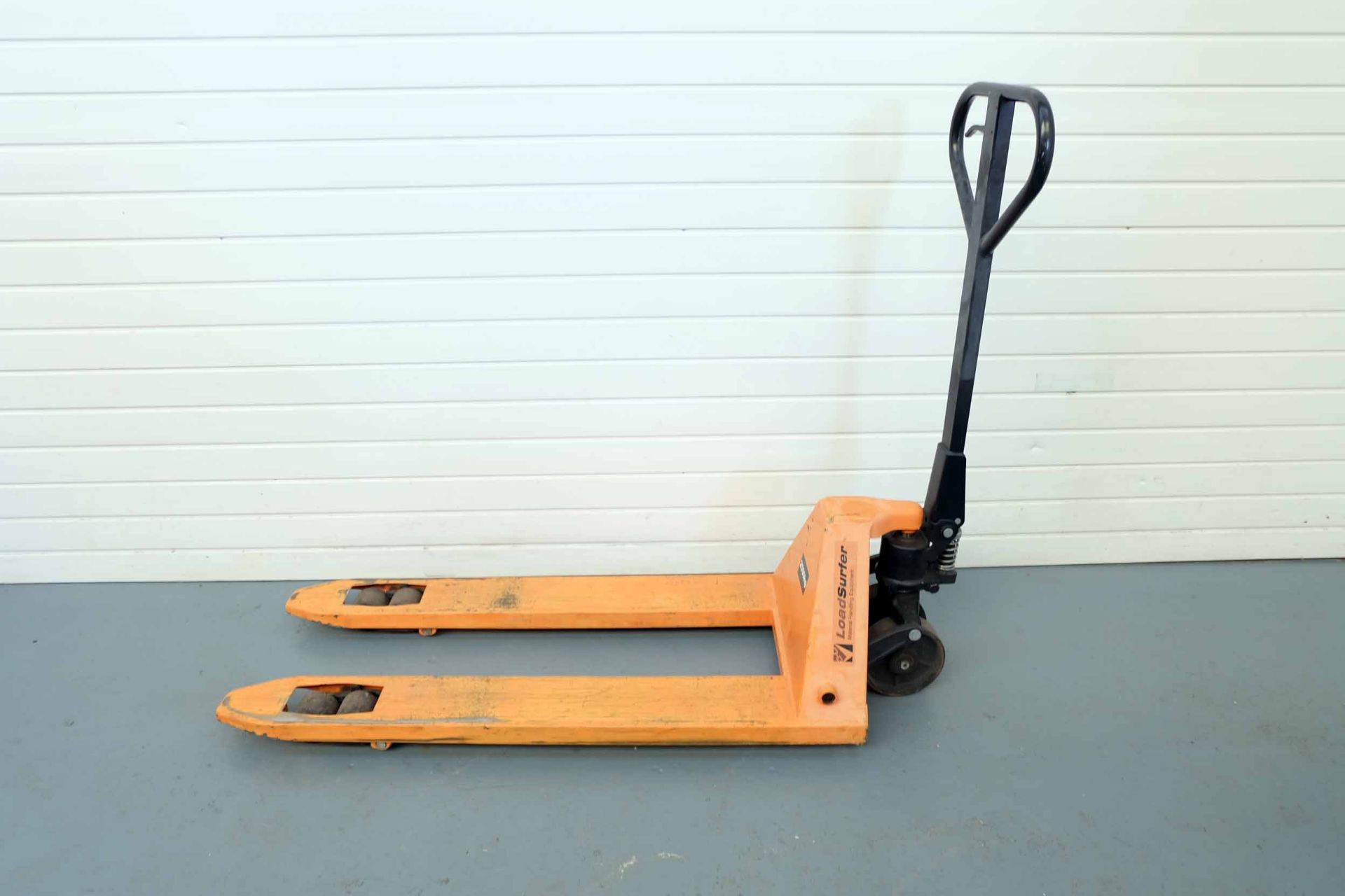 Load Surfer Pallet Truck. Capacity 2500kg. Length of Forks 1150mm. Width of Forks 525mm.