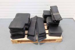 Pallet of Heel Pads for Car Mats. Various Shapes & Sizes. Black Rubber. Some Dotted & Some Check Pla