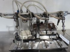 Enol Master Four Head Benchtop Bottling Machine.