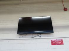 Large Wall Mounted TCL Flatscreen Television, Approx 60 Inch.