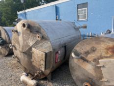 Used approximately 1500 gallon vertical T304L stainless steel tank with internal coil. Approximately