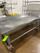 STAINLESS STEEL TABLE ON WHEELS