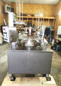 World Cup 12-Station Rotary Head Filler Lidder, Model 12-32. This World Cup Model 12-32 is a 12-