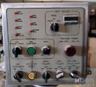 BWI HOLMATIC ROTARY CUP FILLER SEALER (Loading Fee $100) (Located Belle Glade, FL)