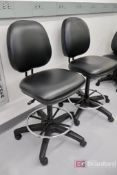 (2) Alera ALEIN4611 Swivel Based Pneumatic Black Laboratory Style Chairs with Metal Foot Rest