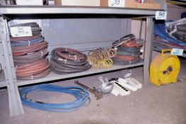 Lot - Air Hose, Extension Cords, Cord Reel, Lights and Power Strips Under (1) Bench