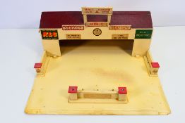 Tri-ang - Minic - A small wooden Tri-ang Minic Service Station measuring 41 x 41 x 19 cm.