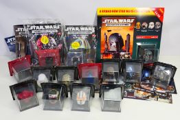 Star Wars - DeAgostini - A group of 1/5 scale Star Wars helmets with their accompanying magazine