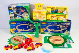 Brio - Curious George - A group of mostly boxed items including Curious George Train,