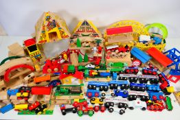 Brio - A quantity of wooden railway system including bridges, track, trains and accessories.