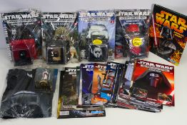 Star Wars - DeAgostini - A group of 1/5 scale Star Wars helmets with their accompanying magazine