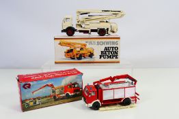 NZG - Conrad - Two boxed diecast model trucks.