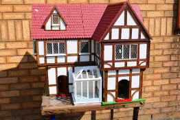 Dolls House - A large wooden Tudor style dolls house with hinged opening roof and removable wall