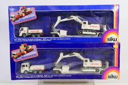 Siku - Two boxed Siku #4012 MAN lorry with trailer & Menck Excavator.