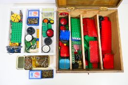 Meccano - A scratch built wooden box containing a quantity of Meccano parts.