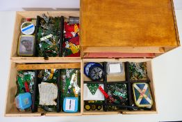 Meccano - A three drawer wooden cabinet containing a large quantity of Meccano parts.