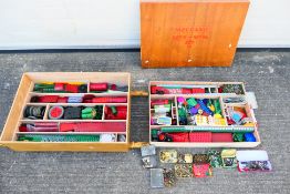 Meccano - A large wooden box of Meccano parts and tools (some contained in unassociated tins) in