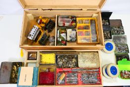Meccano - A scratch built wooden box containing a large quantity of Meccano parts in various