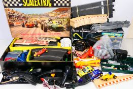 Scalextric - A collection of items including a boxed vintage set 50, 3 x unboxed cars,