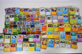 Pokemon - A quantity of Pokemon cards including some holo and reverse holo cards,