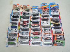 Hot Wheels - Matchbox - A group of 45 x carded models including DeLorean, Dodge Challenger,