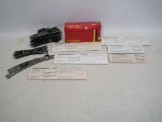 Hornby - 14 x sets of OO gauge points still in their packaging, and a quantity of unboxed pieces,