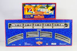 Disney - A boxed Walt Disney World battery powered Monorail set with a box of extra track pieces