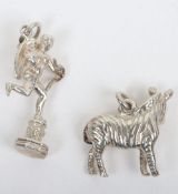 A silver bracelet with six silver charms