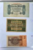 A folder of German banknotes