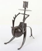 An Anglo-Indian metalware candlestick and inkwell with traces of gilding