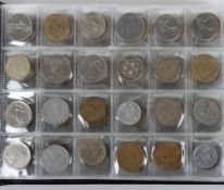 A folder of mostly world coins, including Kenya, Poland etc