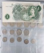 A folder of GB coins and notes