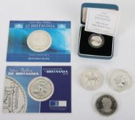 Three Britannia silver coins, a 1977 silver proof crown, silver One Pound proof, and a Liberia 5 Dol