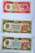 A folder of banknotes including France, Israel