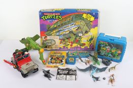 Collection of Vintage Teenage Mutant Hero Ninja Turtles and Jurassic Park Toys.