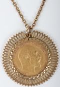 A 1902 Half Sovereign on 9ct mount and chain,
