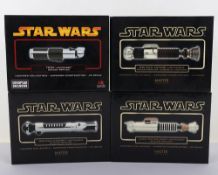 Four Star Wars Master Replicas Scaled Lightsaber’s boxed.