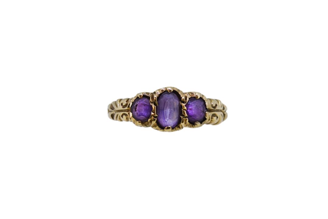 A 9ct gold amethyst three stone ring, - Image 1 of 4