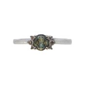 A green sapphire and diamond ring,