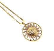 A diamond set sun pendant and chain,