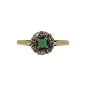An emerald and diamond cluster ring,
