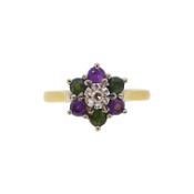 An 18ct gold diamond, amethyst and emerald cluster ring,