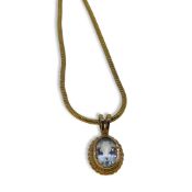 An aquamarine pendant and chain,