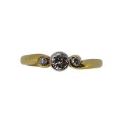 An 18ct gold three stone diamond ring,