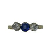An 18ct gold sapphire and diamond three stone ring,