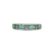 A 9ct gold green beryl and diamond half hoop style ring,
