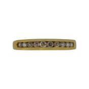 An 18ct gold diamond set half hoop ring,