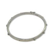 A 9ct gold diamond set bangle,