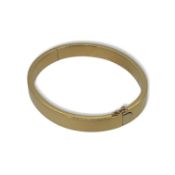 An 18ct gold bangle,