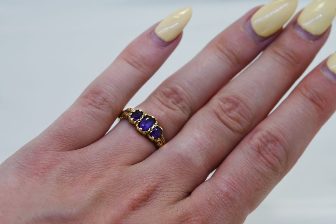 A 9ct gold amethyst three stone ring, - Image 4 of 4